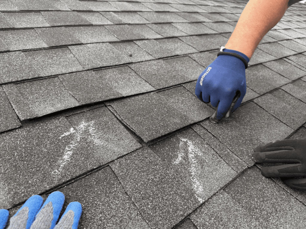 Jacksonville roofing company doing a roof inspection on a home to look for damage before providing an estimate.